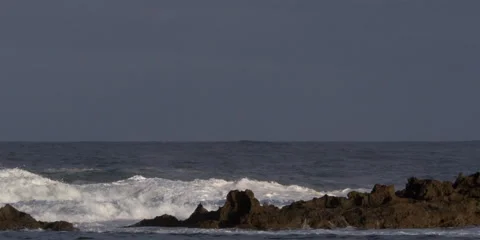 Foaming waves exploding above a rocky reef Stock Footage 59525355