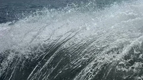 Foaming waves near the side of the ship. Close-up view of water splashing Stock Footage 336605475