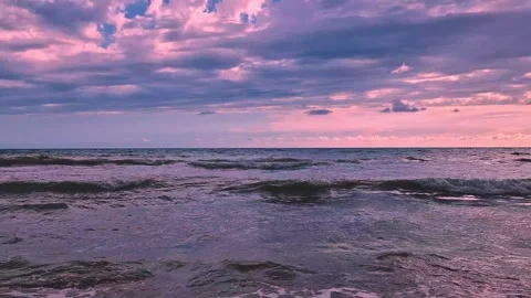 Foaming Waves Roll on a the Beach in the Ocean and a Pink Lillac Sunset Sky, Sun Stock Footage 296270915
