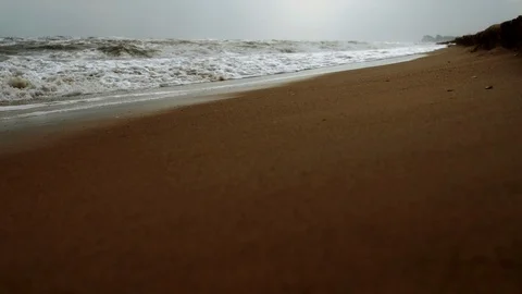 Foaming Waves on a sandy beach Stock Footage 107985485
