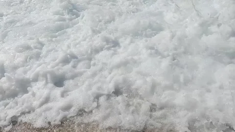 Foaming waves splashing on the beach Stock Footage 316878389