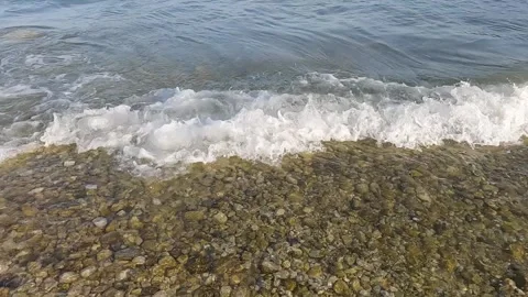 Foaming waves splashing on the beach Video stock 317309058