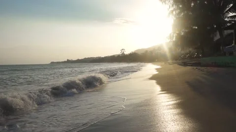 Foaming waves on sunset beach. Slow motion Stock Footage 58743421
