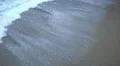 Foamy ocean waters splashing ashore, cold waves washing beach sand, off-season HD Footage