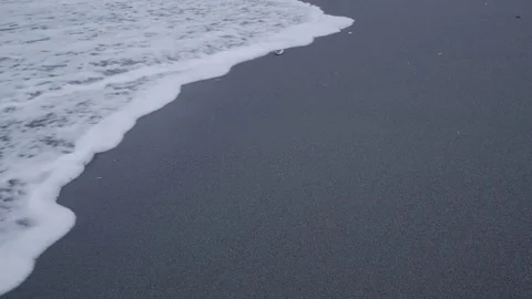 Foamy Ocean Waves Rolling onto Sandy Beach Stock Footage 81344508