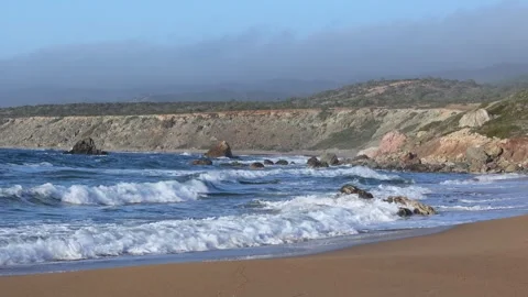 Foamy Ocean Waves Rolling Onto Sandy Beach Stock Footage 341506772