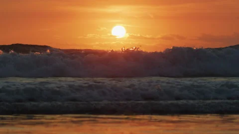 Foamy ocean waves at sunset Stock Footage 218444311