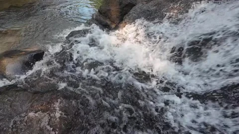 Foamy River Water Flowing Through Rocky Stream in 4K Stock Footage 337309340