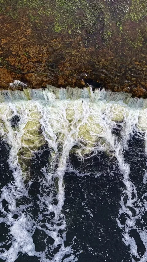 Foamy River Weir Cascade Streams Down Rocky Ledge Aerial Drone Abstract Water Stock Footage 336780525