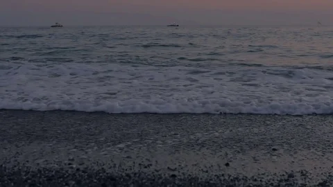 Foamy sea waves and a pebble beach Stock Footage 80245387