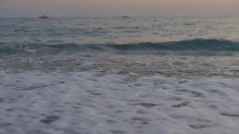 Foamy sea waves and a pebble beach Stock Footage 80273648