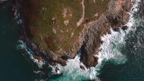 Foamy Sea Waves Breaking On Granite Rock Shores. Aerial Topdown Shot Stock Footage 318231981