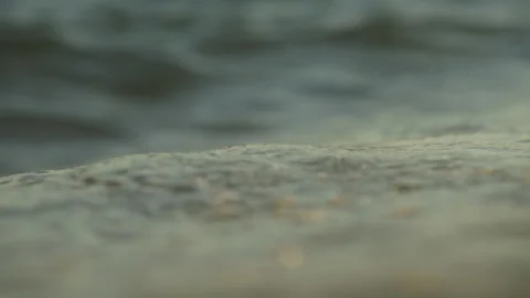 Foamy sea waves rolling Stock Footage 212889788