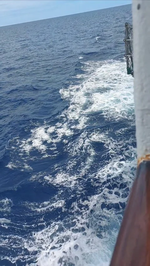 Foamy ship wake and deep blue ocean water in Indonesia. Stock Footage 346161263