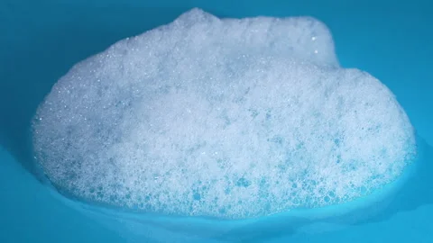 Foamy soap bubbles texture background rotates, close up Stock Footage 339062377