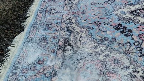 Foamy Soap Suds on Patterned Area Rug Stock Photos