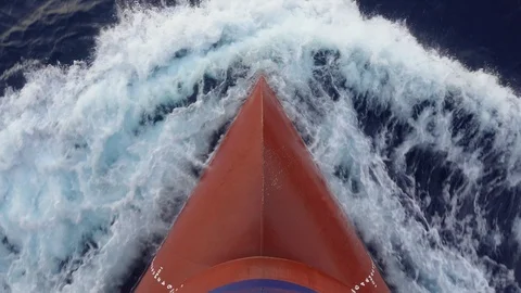 Foamy splashes of a waves against the merchant ship's red bulb. Stock-Footage 100118154