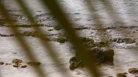 Foamy splashing ocean tide waves washing over rocky shore Vídeo Stock 36563606