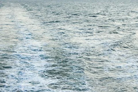 Foamy Wake Across Ocean Surface Stock Photos