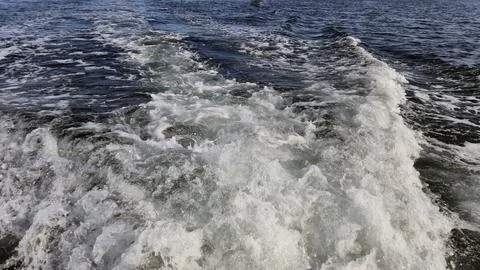 Foamy Wake on Open Water Surface Stock Photos