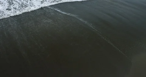 Foamy wave on the beach Stock Footage 96471131
