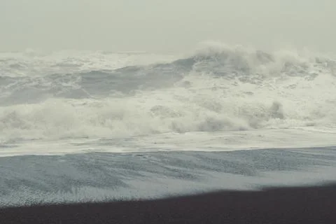 Foamy wave rolling on sand landscape photo Stock Photos