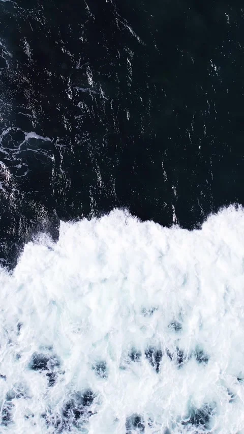Foamy wave rush fast, transform dark ocean water to white turbulent surface Stock Footage 245420390