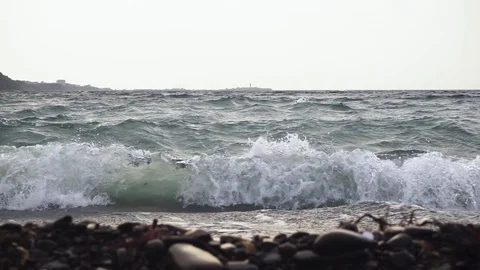 Foamy waves beat on the shore slow mo Stock Footage 82614875