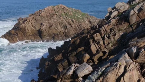 Foamy Waves Breaking Against The Rocks Stock Footage 323433140