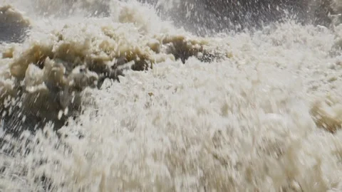Foamy waves crash with force, sending mist into air Stock-Footage 346389495
