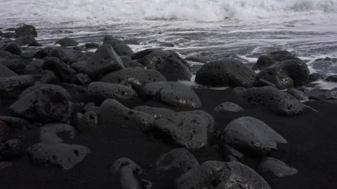 Foamy Waves Crash over Volcanic Coastline Stock Footage 236751372
