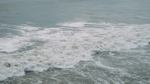 Foamy waves during a storm. Rainy day. Видео 88260657