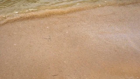 Foamy Waves Hit Sandy Beach Stock Footage