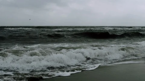 Foamy waves on a raging sea Video stock 107991000