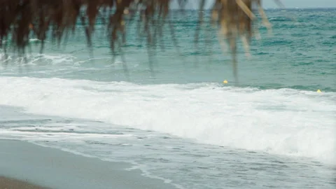 Foamy waves reaching a beach Stock Footage 220226910
