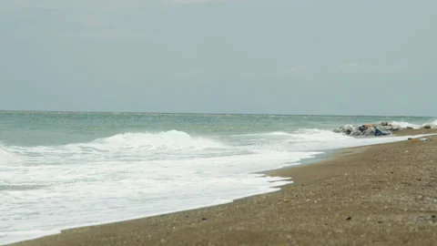 Foamy waves reaching Perissa beach, Santorini, Greece Stock Footage 220228105