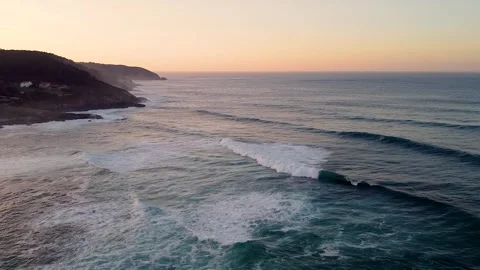 Foamy Waves Rolling On The Beach  At Sunset - drone shot, slow motion Video stock 243818299