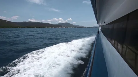 Foamy Waves side view  Of Sailing Ship. Boat cruises near island Stock Footage 71031845