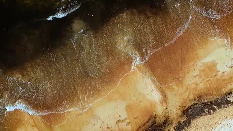 Foamy waves touching bright sandy shore Stock Footage 323607166