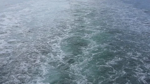 Foamy white trail spreading behind maritime vessel Stock Footage 304726607