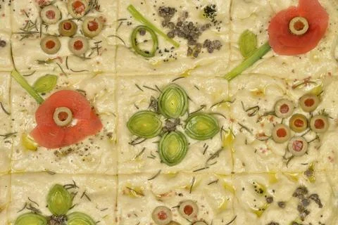 Focaccia art with vegetable flower patterns Stock Photos