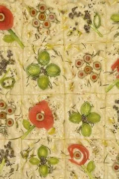 Focaccia art with vegetable flower patterns Stock Photos