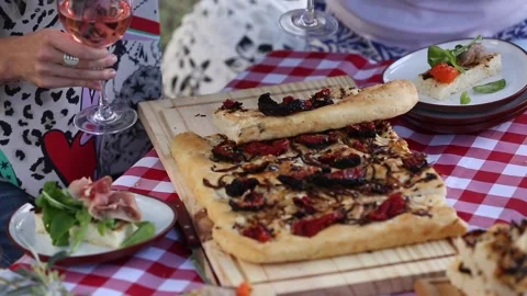 Focaccia bread with onions and dried tomatoes Video stock 133748652