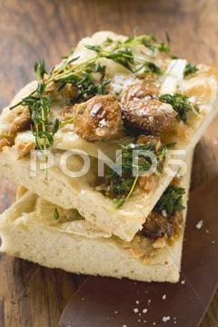 Focaccia with goat's cheese and almonds Stock Photos