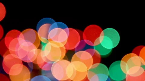 Focus and blur of colorful bokeh lights, on black background Stock Footage