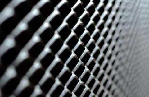 Focus and blurred of dark gray and silver grid of metal fence that taking a.. Stock Photos