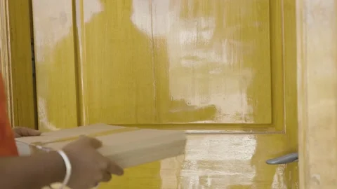 Focus on box, Close up shot of delivery giving parcel to consumer after opening Stock Footage 169153216
