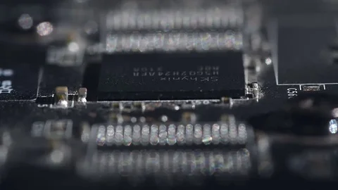 Focus camera panning on a computer GPU hardware black microchip and transistors Stock Footage 76810179