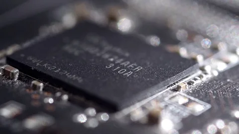 Focus camera panning on a computer GPU hardware black microchip and transistors Stock Footage 76810520