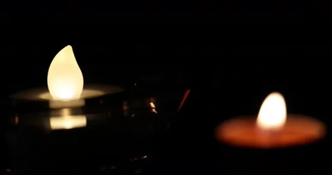 Focus change on LED light and wax candle flame light glowing jumping throbbin Stock Footage 172425383